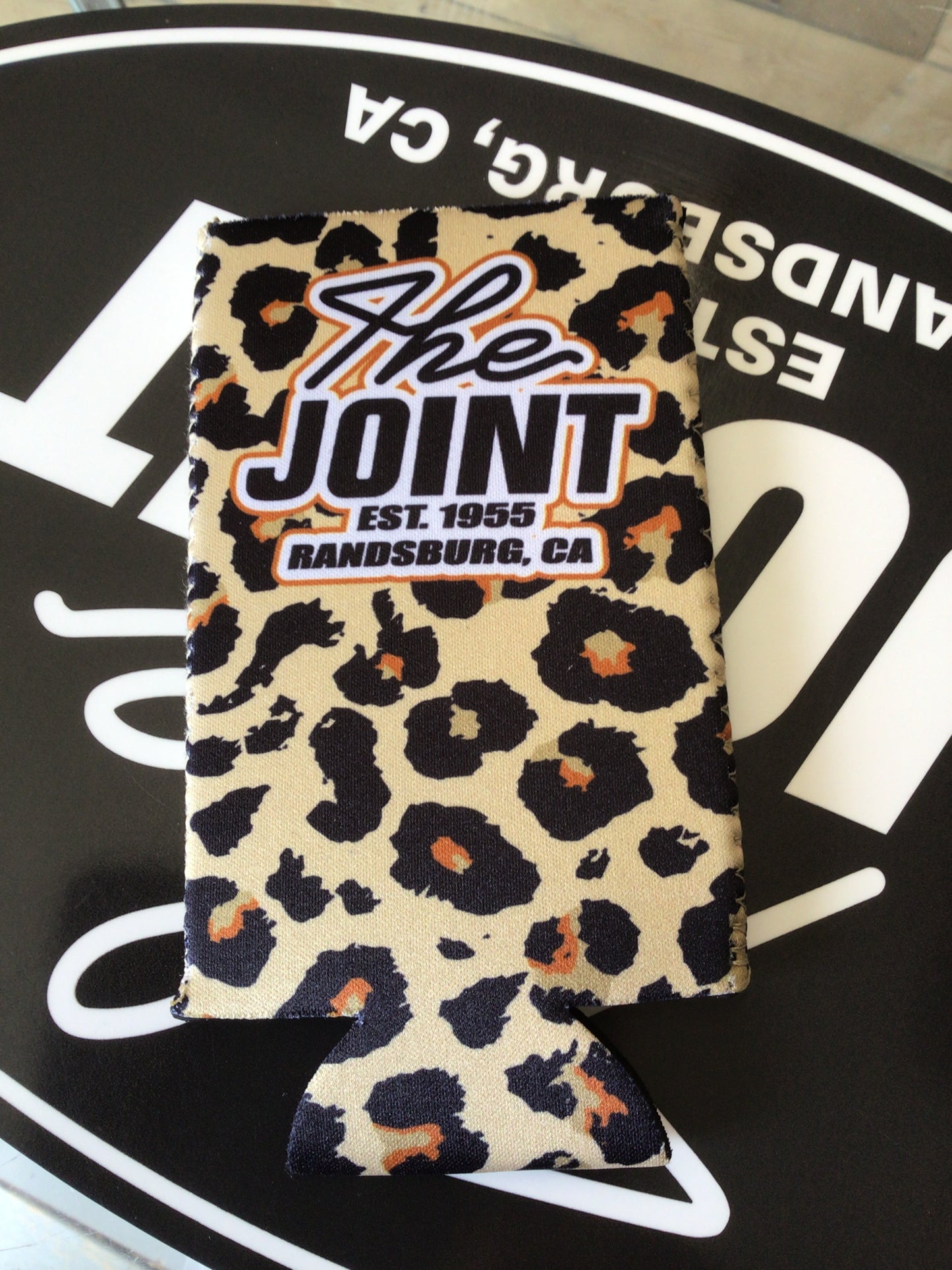 Leopard print product with 'The Joint' branding on a black background